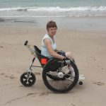 Outdoor sandy beach surfaces are no issue with Trekinetic's K2 manual wheelchair with rear shock absorbtion built-in.