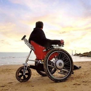 Trekinetic GTE wheelchair rides along sandy beach terrains.